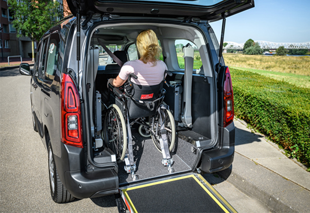 Women getting into wheelchair van